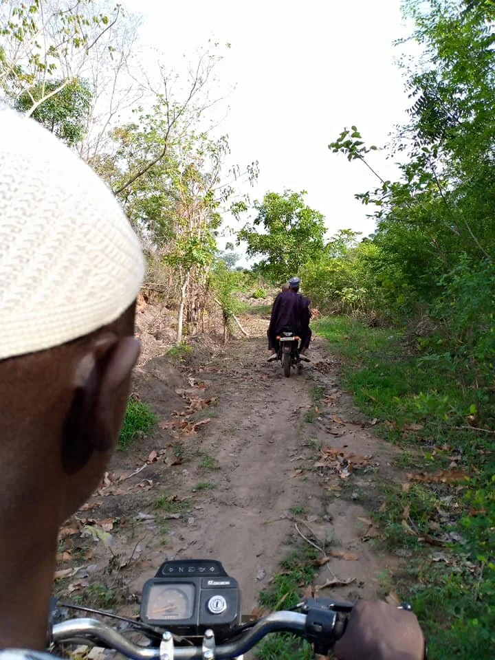  Alhaji Bature led the way to the Fulani village. 