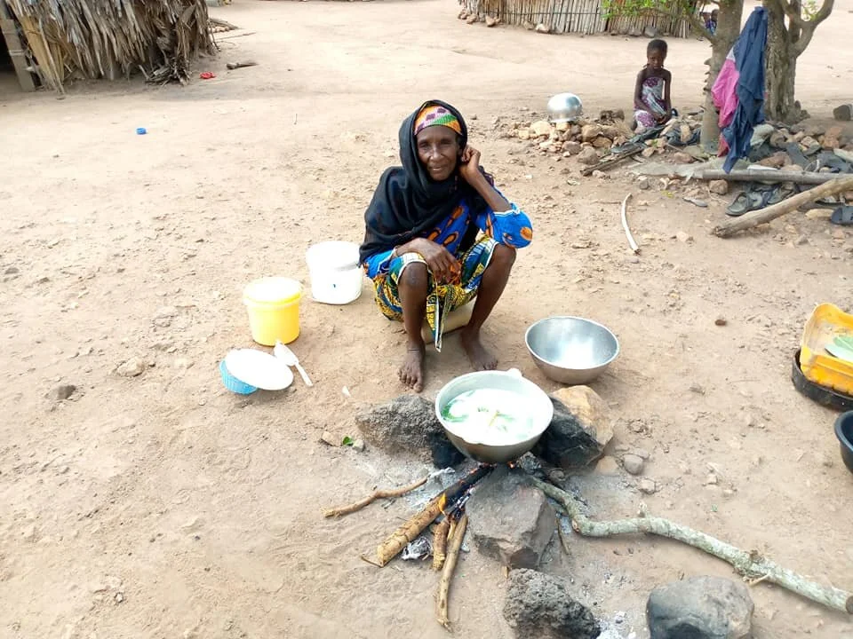  This is Alhaji Shehu's wife, boiling milk to sell. 