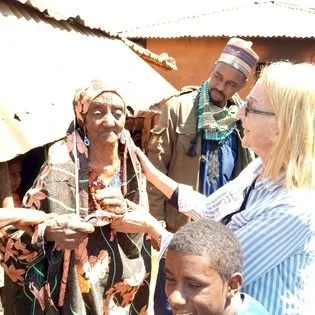   This Fulani matriarch is 100 years old! She couldn't stay out in the bright light for long because the sun bothered her eyes. We finally got a good picture of her lovely face.  