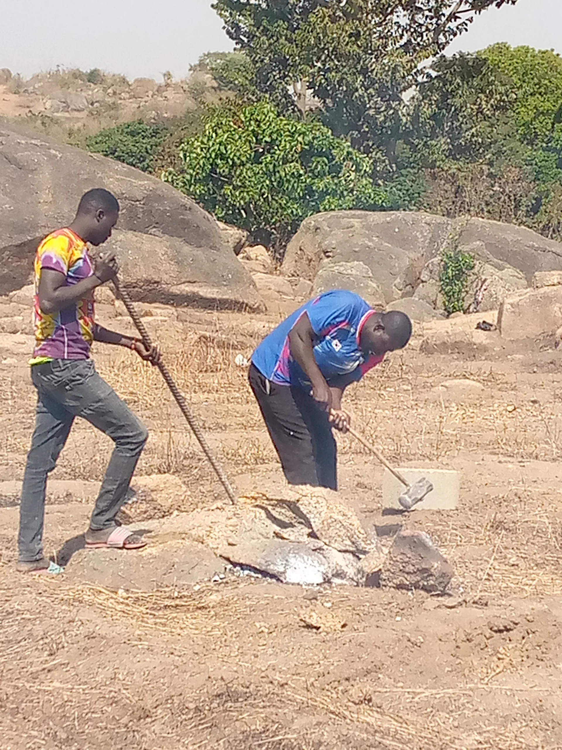  This ground is SO ROCKY, but there's no problem! We already hired some men to come and break up the stones within the area of the church building.&nbsp; 