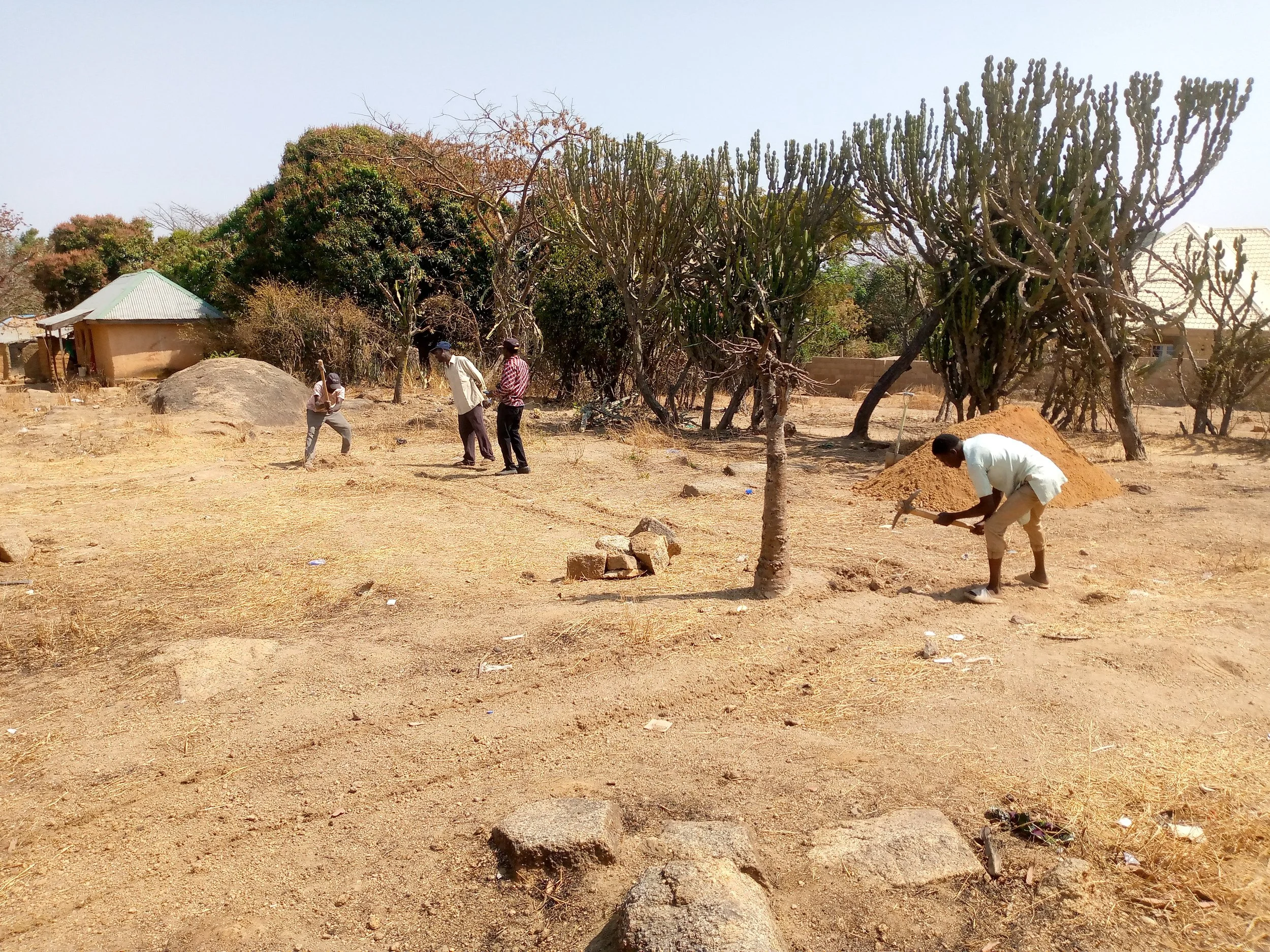  These are volunteers from the community, helping with the work. One elderly woman is also helping to carry stones. She wouldn't let Phyllis take her picture. :) 