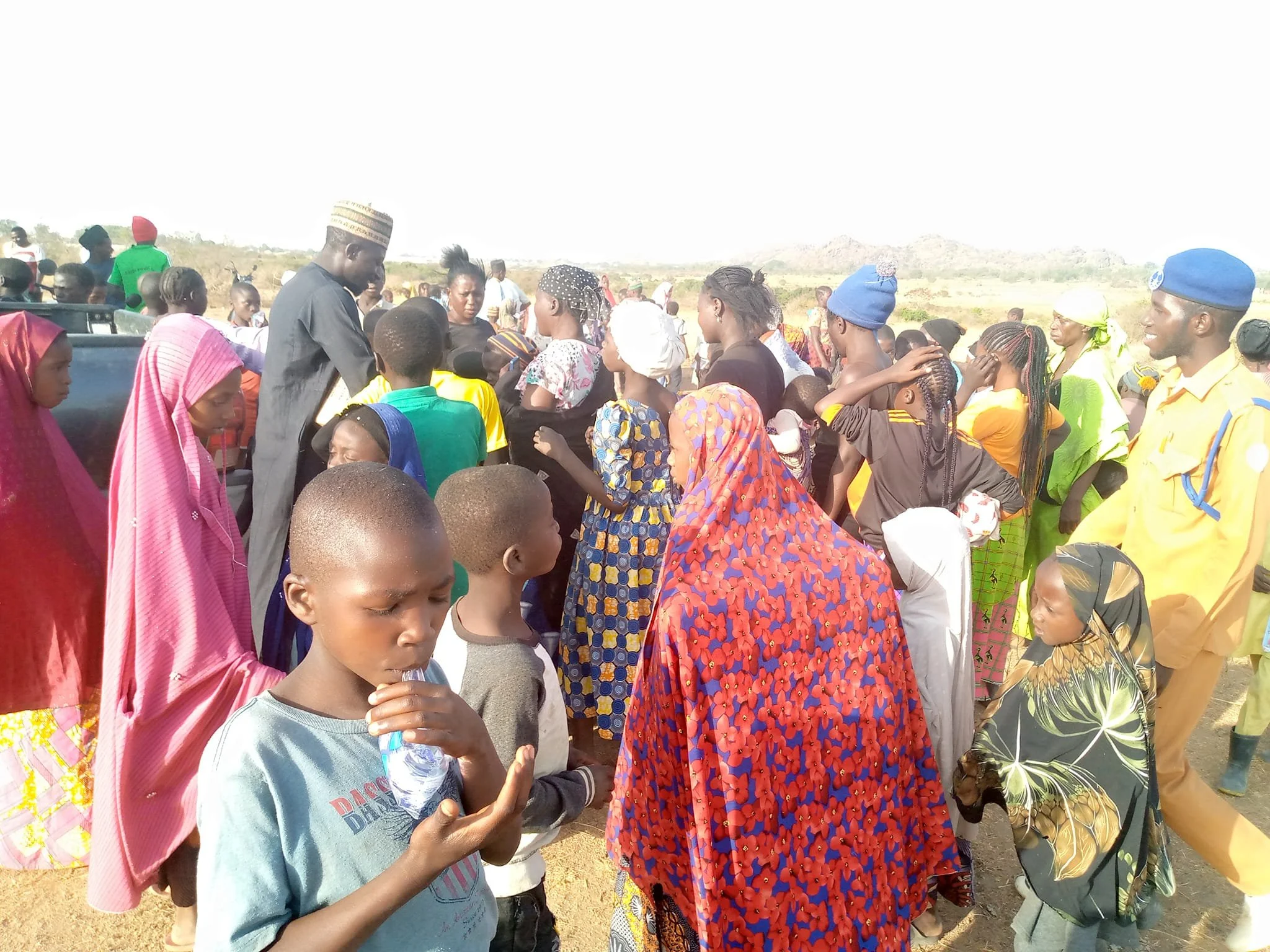   HUNDREDS  of parents and children came to meet us at the school site. The children, now out-of-school, knowing they will soon be IN school, were FULL OF JOY! There is great support from the parents and local chief, too! 