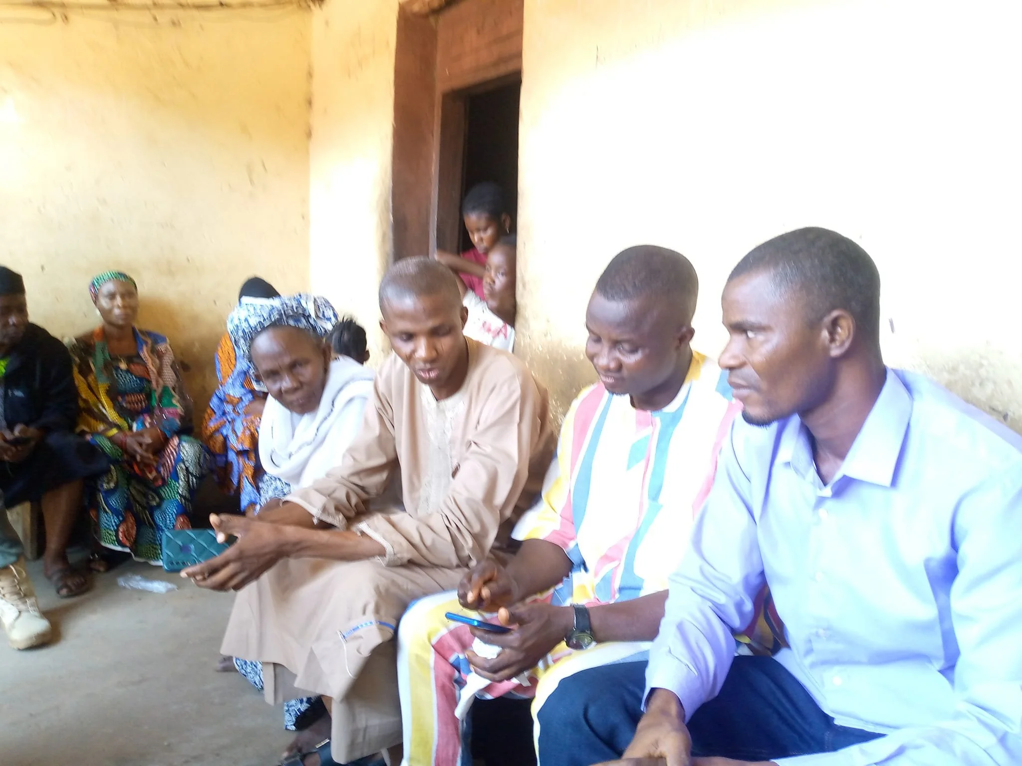    Reverend John Raji chats with Jimoh   