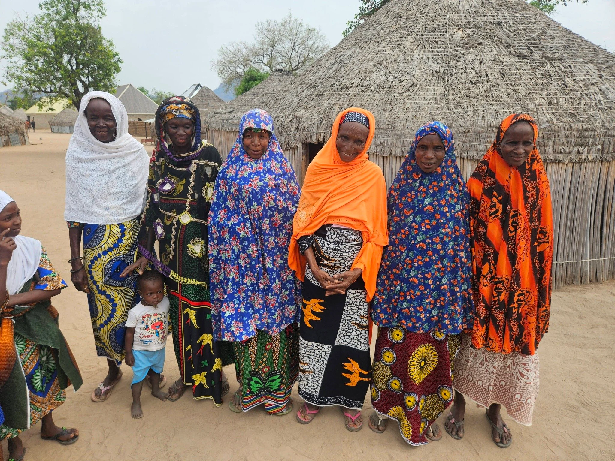  What a sweet group of Mamas and Grandmas! Nigerian women dress in SUCH beautiful, bright colors! They are SO happy to have a school for their children. 
